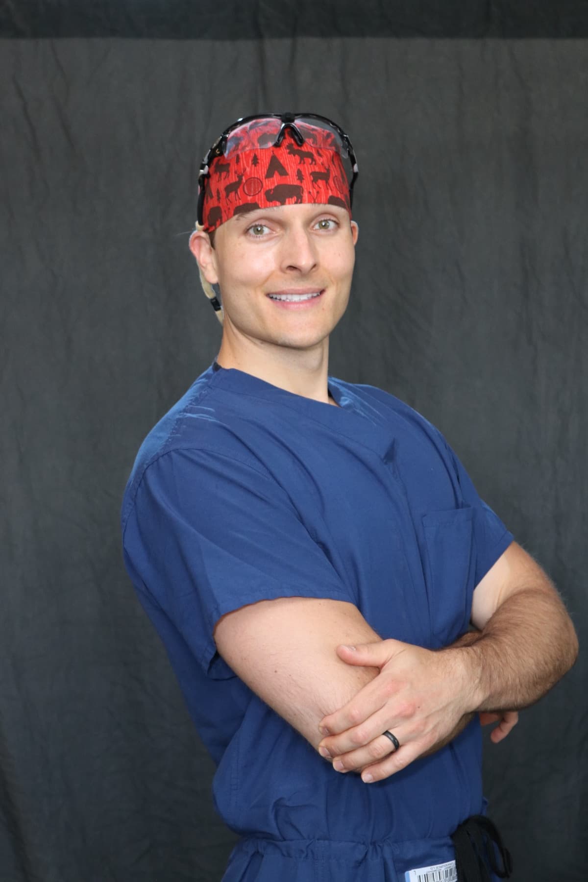Dr. Justin T. Smith in surgical scrubs
